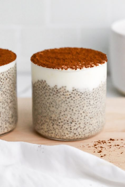 Front facing view of tiramisu chia pudding in 2 glasses with a layer of greek yogurt. Autumn Chia Pudding, Chia Pudding Tiramisu, Chia Seed Pudding Tiramisu, Tiramisu Chia Pudding Recipe, Green Chia Pudding, Chia Greek Yogurt Pudding, Tiramisu Chia Seed Pudding, Single Serve Chia Pudding, Chiaseedpudding Recipe