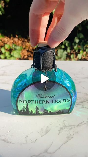 Forbidden Forest Apothecary on Instagram: "Northern Lights ✨🩵✨🩵✨🩵✨🩵✨ Magical, decorative, color changing potion bottles available in my shop!  #potion #potions #fantasy #art #magic #smallbusiness #smallbusinessowner #bookshelfdecor #potionbottle" Color Changing Potion Diy, Forest Apothecary, Diy Potions, Moon Potion, Potion Maker, Color Changing Potion, Magic Potion Bottles, Crow Moon, Bottle Decorations