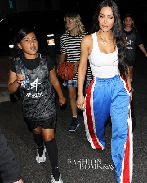 Fashion Bomb Daily on Instagram: "@kimkardashian attended daughter #northwest ‘s basketball game wearing a white tank and @vetements_official snap track pants. Thoughts? 📸…" Basketball Pants Outfit Women, High School Basketball Game Outfit, College Basketball Game Outfit Women, Basketball Game Fits, Game Day Outfit Basketball, Basketball Girls Outfits, Basketball Game Outfit Women, Basketball Outfit, Husband Fashion