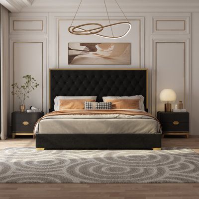 With their contemporary design, these queens, and king beds add excitement to your bedroom décor. It has a tufted upholstered velvet fabric headboard. Built on a solid wood frame with accents nail head application adds beauty to the bed. | Everly Quinn Valmar Morden Tufted Upholstered Golden Platform Bed Black 55.0 x 83.0 x 85.0 in | HMPS1043_76862388_77379556 | Wayfair Canada Black And Gold Bedroom Decor, Recamaras King Size, Tufted Platform Bed, Black Bedroom Decor, Black Bed Frame, Gold Bed, Black Headboard, Yellow Bedding, Fabric Headboard