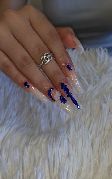 Light Blue Acrylic Nails Design Quince, Blue Rhinestone Acrylic Nails, Blue Marble Nails With Rhinestones, Blue Nail Designs With Gems, Royal Blue Nails Xv, Navy Blue Tapered Square Nails, Tapered Square Nails Royal Blue, White Nails Blue Rhinestone, Blue Acrylics With Rhinestones