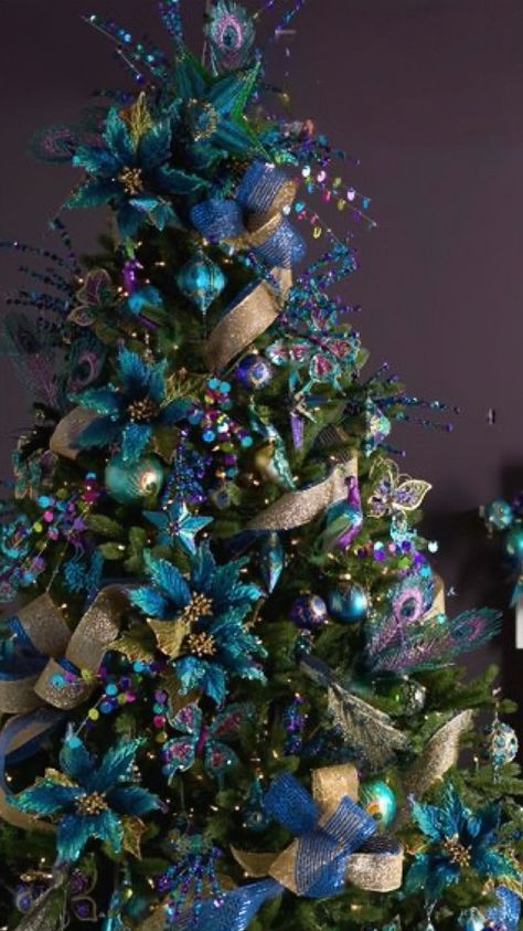 Teal Christmas Trees, Teal And Purple Christmas Tree, Peacock Color Christmas Tree, Peacock Themed Christmas Tree, Peacock Tree Christmas, Peacock Theme Christmas Tree, Teal Christmas Tree Ideas, Teal Christmas Tree Decorations, Peacock Christmas Tree Ideas