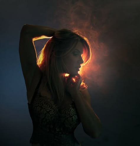 Back light woman dramatic orange smoke fog Photography Back Lighting, Split Lighting Portrait, Portrait Interesting Lighting, Fun Lighting Ideas Photography, Creative Lighting Portraits, Dramatic Studio Portraits, Light Behind Person, Cool Lighting Portrait, Lighting From Behind Reference