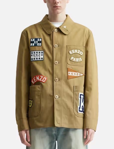 KENZO Sailor Workwear Jacket Men's S Khaki Collared Long Sleeve Button Closure KENZO Sailor Workwear Jacket Men's S Khaki Collared Long Sleeve Button Closure Retail $1,195.00  This Kenzo 'kenzo Sailor' Work Jacket is a stylish and functional addition to any wardrobe. Made from 100% cotton with a patchwork pattern, this jacket features a button closure and comes in a khaki color. It is perfect for workwear and walking during the fall and spring seasons. The jacket is designed with a collared neck Japanese Workwear Vintage, Japanese Workwear, Fashion Workwear, Vintage Varsity Jacket, British Style Men, Workwear Vintage, Patch Embroidery, Designer Jacket, Workwear Jacket