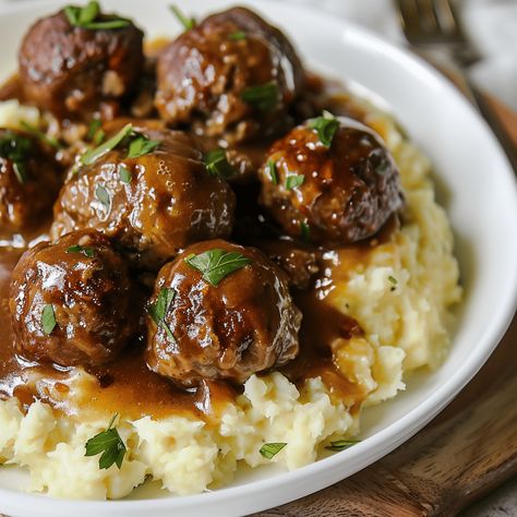 Savor the comfort of "Comfort Classic: Slow Cooker Salisbury Steak Meatballs," a hearty and delicious dish that transforms the traditional Salisbury steak into succulent, easy-to-serve meatballs. Cooked slowly in a rich mushroom gravy, these meatballs Philly Cheesesteak Pasta, Cheesesteak Pasta, Salisbury Steak Crockpot, Meatball Recipes Crockpot, Salisbury Steak Meatballs, Slow Cooker Salisbury Steak, Crockpot Steak, Rasta Pasta, Meatballs And Gravy