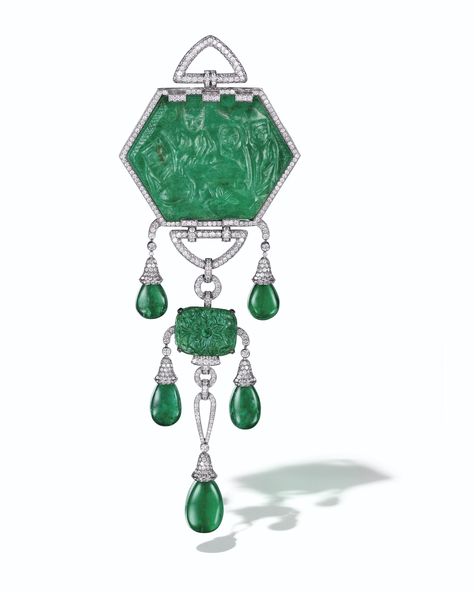 A CARVED EMERALD WITH TWO INTERCHANGEABLE EMERALD AND DIAMOND MOUNTINGS, CARTIER Interchangeable brooch set with a hexagonal carved emerald of 380.98 carats, reversible with one side depicting Lord Rama, his wife Sita and their loyal servant, the monkey god Hanuman, the reverse depicting a poppy blossom, circular-cut diamonds, platinum (French mark), 2 ¾ ins., emerald 19th century, signed MT Cartier, maker's mark, no. SC2697 Cartier Brooch, Ideal Husband, Emerald Brooch, Carved Emerald, God Hanuman, Bijoux Art Deco, Lord Rama, Mark 2, Historical Jewellery