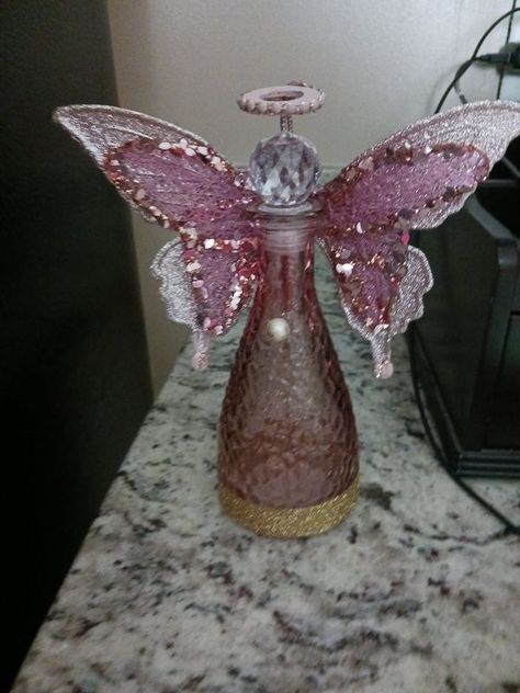 Dollar Tree Fanatics Crafts & Decor | This is my Dollar Tree bottle Angel and if you're having trouble finding the wings these are butterfly ornaments in the Christmas department at Walmar... | Facebook Diy Angel Wing Ornaments, Dollar Tree Angel Wings Ornament, Diy Dollar Store Crafts Christmas, Dollar Tree Angel Wings, Angel Vases, Altered Bottles Diy, Christmas Angel Ornaments Handmade, Angel Wing Crafts, Christmas Angels Diy