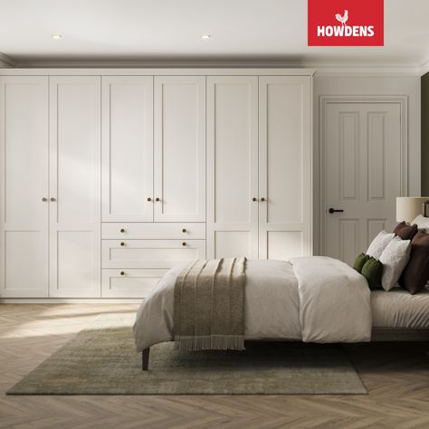 Unlock the art of bedroom design with our fitted wardrobe ideas. Elevate your space with fitted wardrobes, capturing the essence of bedroom ideas that transcend trends. Immerse in the tranquility of white bedroom aesthetics, exploring the perfect blend of style and comfort for your master bedroom. Find inspiration in our curated collection of traditional bedroom designs. Redefine your space with our white bedroom ideas, and discover the ultimate bedroom inspiration with Howdens. Bedroom With Wall Wardrobe, Newbuild Bedroom Ideas, Howdens Fitted Wardrobes, Bedroom Fitted Furniture, Howdens Wardrobes, Howdens Bedroom, Hammonds Fitted Wardrobes, White Bedroom Cupboards, Closet Room Aesthetic