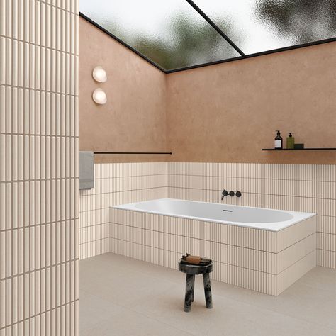 Subtle yet striking, our Faenza kit kat tiles will help you create a bathroom or kitchen that’s bound to turn heads. It’s safe to say that you’ll love them, especially if you’re a fan of the Japandi trend.From the softly rounded fingers to the subtle glaze sheen, everything about these tiles feels just right. They catch the light in a simply beautiful manner - with speckled glaze and a beige outline adding a gorgeous handmade style finish to each piece.The pale tones are simply divine and are we Bathroom Interior Design Cream, Tiled Bath Surround, Kitkat Bathroom Tile, Porcelanosa Bathroom Tiles Inspiration, Tiles Behind Bath, Cream And Wood Bathroom, Finger Tile Bathroom, Kitkat Bathroom, Tiles Around Bath