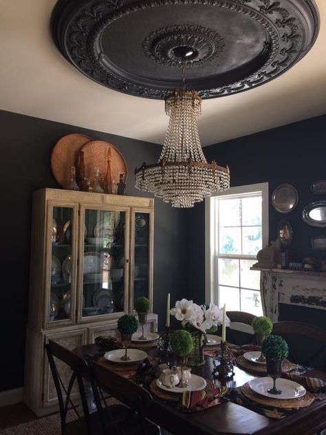 Black dining room Ceiling medallion  Crystal chandelier Dining Room Ceiling Medallion, Moody Dining Room Chandelier, Southern Gothic Dining Room, Chandelier With Ceiling Medallion, Chandelier Ceiling Medallion, Black Ceiling Medallion, Gothic Farmhouse Dining Room, Moody Maximalist Dining Room, Dark Academia Chandelier