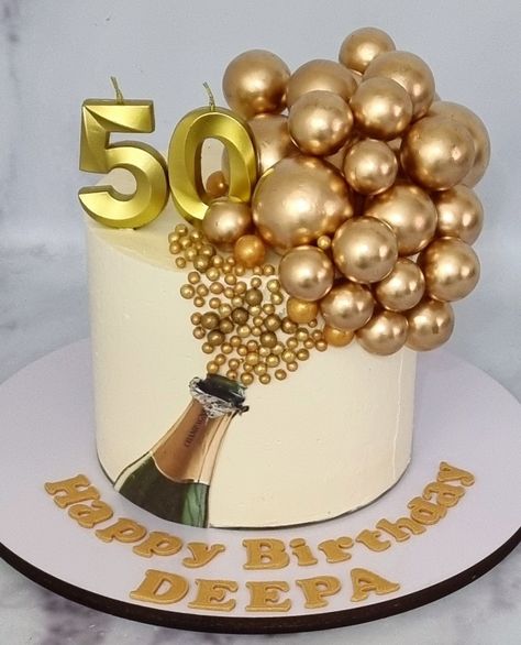 Champagne bottle cake decorated with Golden faux balls Champagne Bottle Cake Ideas, Champagne Cake Ideas, Mens 70th Birthday Cake, Champagne Theme Cake, Birthday Cake With Champagne Bottle, Cake With Balls Decoration, Champagne Cake Design Birthday, Cake With Champagne Bottle, Champagne Party Decorations