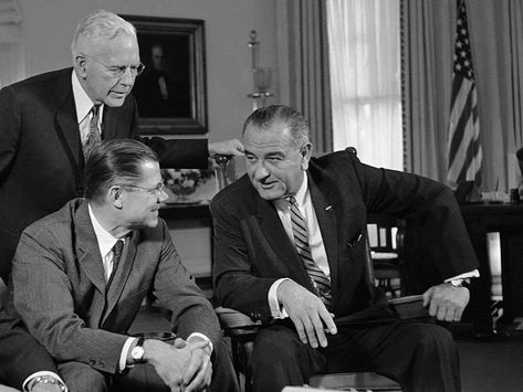 President Lyndon B. Johnson, right, talks with Secretary of Defense Robert McNamara, sitting, after McNamara had returned from a fact-finding trip to Vietnam, at the White House on March 13, 1964. Robert Mcnamara, Lyndon B Johnson, South Vietnam, American Presidents, Muhammad Ali, Public Relations, Historical Photos, Role Models, The Truth