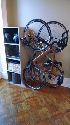 Picture of Freestanding Bike Rack/Bookcase Small Apartment Storage Solutions, Apartment Storage Solutions, Bike Storage Home, Freestanding Bike Rack, Bike Storage Apartment, Diy Bike Rack, Small Apartment Storage, Bike Storage Garage, Bike Rack Wall