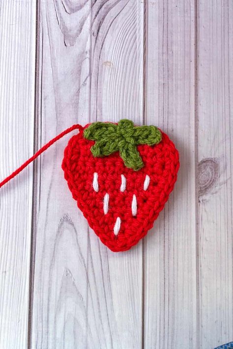 Crochet Strawberry Applique Pattern - thecaffeinatedsnail.com Crochet 2d Strawberry, Strawberry Applique Pattern, Crochet Strawberry Applique, 2d Crochet, Cute Crochet Strawberry, Winnie The Pooh Crochet, Strawberry Blanket, Backpack Patterns, Pooh Crochet