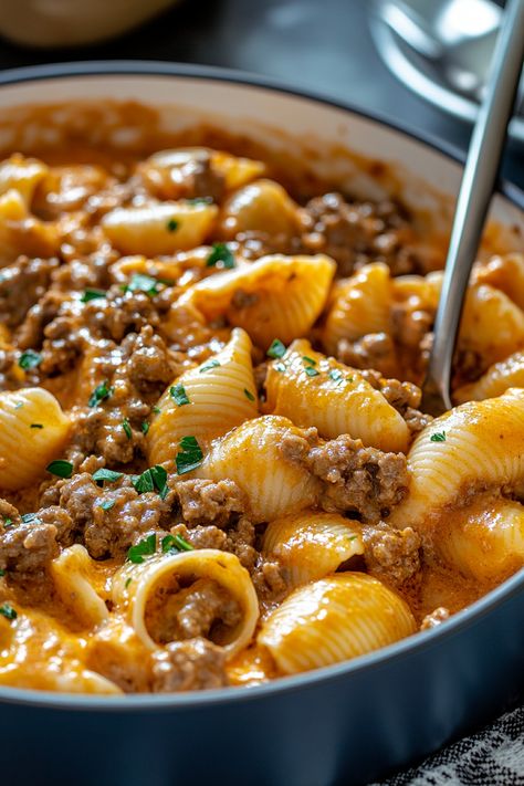 Creamy Beef and Shells is a comforting, rich dish that combines tender pasta shells with savory ground beef in a luscious, cheesy sauce. It’s the perfect balance of flavor and indulgence, ideal for busy weeknights or whenever you’re craving a hearty, home-cooked meal. This quick and easy recipe will become a regular on your dinner Ground Beef And Macaroni Recipes Easy Dinners, Yummy Crockpot Recipes, Creamy Beef Bow Tie Pasta, Cheesy Beef Noodles, Cheese Shells Pasta, Ground Beef Cheesy Pasta, Cheesy Italian Shells Hamburger Helper, Heavy Cream Recipes Dinner Pasta, Beef And Shells Pasta