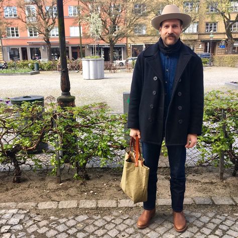 Olof takes good care of his style. Open road hat by Stetson, peacoat by Schott, jean shirt by KOI, jean by 3sixten and Red Wings on his feet. His tote bag is by Le Shop Sage. #mensstyle #menswear #rugged #hat #stetson #peacoat #schottnyc #jeanshirt... Open Road Stetson, Stetson Open Road Mens Fashion, Western Hat Outfit, Open Road Hat, Western Winter Outfits, Stetson Open Road, Peacoat Outfit, Western Winter, Urban Hippie