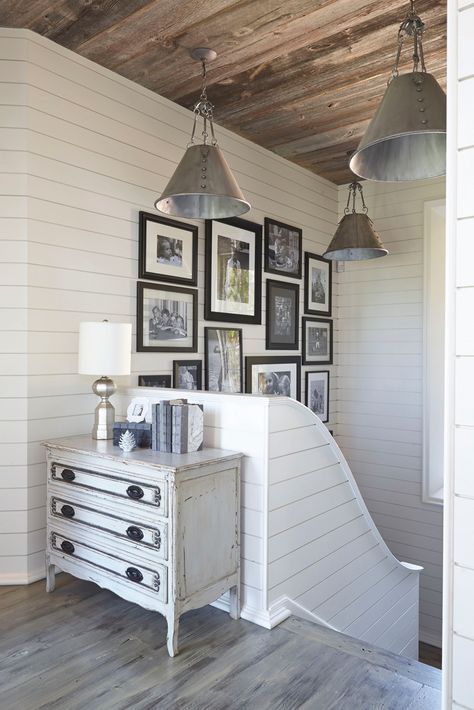 The stairwell leading into the Lake Martin home from the lakeside deck is adorned with family photos, showcasing some of the owners' most cherished memories in a place where they'll surely make more. | VIE Magazine: Culinary & Couture Issue March/April 2017 | "Casual Elegance on Lake Martin" | Photography by Jean Allsopp Lakeside Deck, Rosemary Beach Florida, Stair Well, Martin House, Window Color, House Stairs, Building A New Home, Farmhouse Lighting, Bonus Room