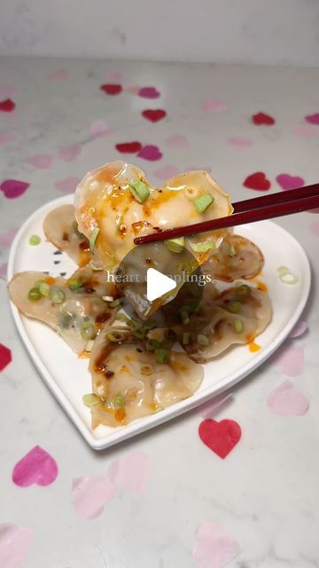 Holly Dingwall on Instagram: "HEART DUMPLINGS 🥟❤️‍🔥

Another super fun valentines recipe and a great way to enjoy your favourite dumplings!! 

INGREDIENTS (makes 15-20)
- 500g pork mince 
- 1 grated carrots 
- 1 handful chopped corriander 
- 2 garlic cloves
- 1 tsp 5 spice 
- 1 tsp light soy sauce, 1 tsp dark soy sauce 
- salt and pepper 
- 1 tsp chilli oil 
- 3 spring onions 
- dumpling wrappers (store bought or homemade) 

METHOD
- Combine all dumpling ingredients in a mixing bowl and stir together with chopsticks 
- Using a heart cooking cutter, cut the dumpling wrappers in to heart shapes 
- Add 1 tsp of filling to one wrapper and brush water over the edges then place another wrapper on top and press the edges together 
- Heat a pan on medium-high heat with 1 tbsp oil and add the dum Heart Dumplings, Valentines Recipe, Dark Soy Sauce, 5 Spice, Chilli Oil, Dumpling Wrappers, Instagram Heart, Spring Onions, Valentines Food