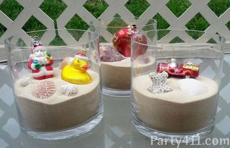 Fun Christmas in July Party Centerpiece made with ornaments, shells, sand and glass vases. Christmas In July Pool Party Ideas, Christmas Vbs, Cousin Sleepover, Aloha Christmas, Christmas In July Decorations, Merry Birthday, Christmas In July Party, Hawaii Christmas, Olympic Party