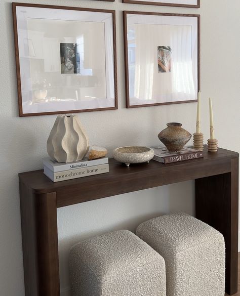 Looking to elevate your hallway or entryway? 🤎⁠ .⁠ Meet the Contour Console Table in Walnut—your go-to for a chic, modern touch. Its minimalist design seamlessly blends with any decor, while offering a stylish platform to showcase your favorite decor. Create a cozy, curated look and elevate your home’s vibe. Click the link in our bio to explore our full range of solid wood console tables!⁠ ⁠ #plankandbeam #console #minimalistaesthetic #quietluxury #hallwaydecor #homedetails #cozylivingroom Entryway Table Apartment, Home Decor Ideas Dark Wood, Living Room Decor Townhouse, Modern Entrance Table, Entryway Into Living Room, Entryway Console Table Decorating, Elegant Entryway Ideas, Entry Way Console Table, Console Hallway