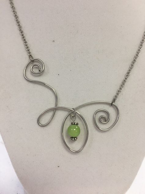 This pendant is made from non-tarnish silver-plated wire on a silver-plated chain. The chain is approximately 16 inches in length and does also have a 3 inch extension. The free-form swirl is hand bent and measures approximately 2.5 inches tall by 3 inches wide. Please note: due to the unique nature of these pendants, wire, chain, and extenders may be different shades of silver. Unique Body Jewelry, Handmade Wire Necklace, Wire Jewelry Pendant, Diy Jewelry Unique Necklaces, Wire Necklace Ideas, Necklace Ideas Handmade, Wire Necklace Diy, Ethereal Accessories, Wire Necklace Pendant