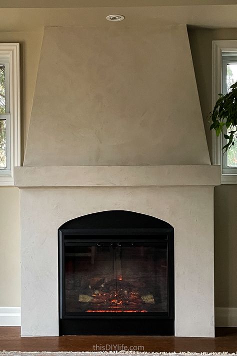 Electric Fireplace Not Built In, Venetian Plaster Fireplace Mantle, Plastered Fireplace With Wood Mantel, Plaster Fireplace With Mantle, Stucco Electric Fireplace, Stucco Corner Fireplace, Painted Plaster Fireplace, Faux Plaster Fireplace Surround, Limewash Electric Fireplace