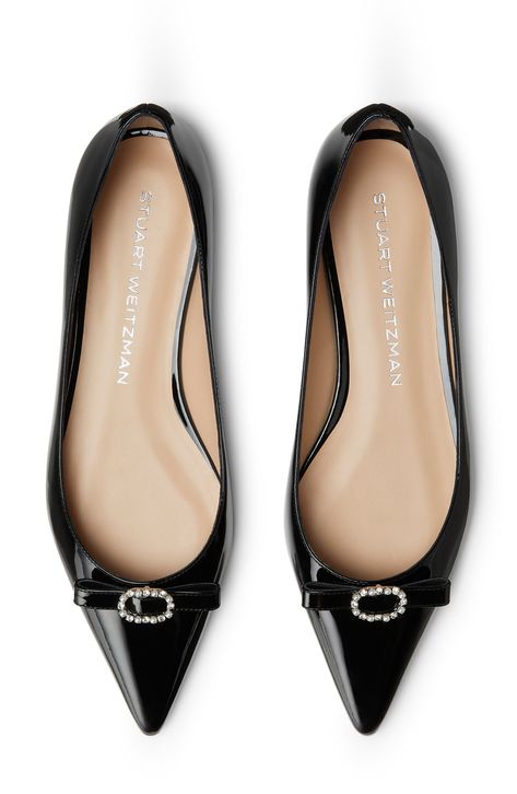 A pert bow secured with a jewelry-inspired buckle highlights the pointy toe of this versatile flat crafted of patent calfskin leather. Leather upper, lining and sole Made in Spain Pointy Flats, Woman Shoes, Pointed Toe Flats, Black Flats, Black Fits, Womens Flats, Stuart Weitzman, Calf Skin, Leather Upper