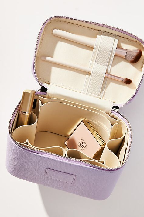 Stash your everyday beauty routine into the Mini Vanity Case - it's small enough to fit into your carry-on suitcase and includes the same divider system you know and love. | Collective Mini Vanity Case by ETOILE in Purple, Nylon/Polyurethane at Anthropologie Mini Vanity, Vanity Bag, Carry On Suitcase, Vanity Case, Leather Products, Beauty Routine, 50 Fashion, Beauty Routines, Color Coding