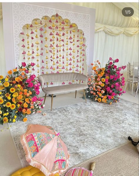 Mendi Stage Decor, Pink And Yellow Indian Wedding Decorations, Pink And Yellow Mehndi Decor, Home Mendhi Decor, Mendhi Backdrop Mehndi Decor, Mehndi Event Decoration At Home, Mendhi Party At Home, Indian Wedding Backdrops, Punjabi Jaggo Decoration