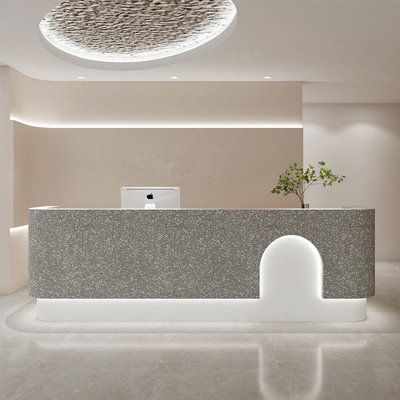 Our reception desk, with its unique design, ensures a memorable experience for every client. Size: 39.37" H x 110.23" W x 23.62" D | Brayden Studio® Clasina 2 Person Rectangular Laminate Reception Desk in White, Size 39.37 H x 110.23 W x 23.62 D in | Wayfair Grey Reception Desk, Reception Desk Ideas, Unique Reception Desks, Stone Reception Desk, Laminate Reception Desk, Micro Concrete, Receptionist Desk, Office Reception Design, White Reception