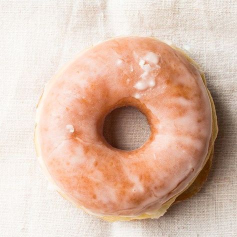 Cookbook author and food photographer Lara Ferroni created this classic doughnut recipe exclusively for Epicurious. For Ferroni's doughnut-making tips and more recipes, see our complete guide to homemade doughnuts. We've included two glaze options, sugar and chocolate, but these doughnuts are terrific on their own or simply dusted with confectioners' sugar.                  If your kitchen is on the cold side, an easy way to create a warm place for the dough to rise is to turn the oven on to ... Doughnuts Recipe, Glazed Doughnuts, Glazed Donut, Stand Mixer, White