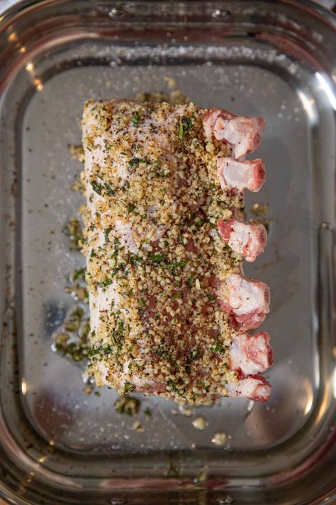 Roasted Rack of Pork is a show-stopping, holiday main dish crusted with garlic, fresh thyme and rosemary or use boneless pork loin for easy weeknight meals. #dinner #pork #porkribs #roastedgarlic #garlic #dinnerthendessert Pork Loin Ribeye Roast Recipe, Rack Of Pork Recipes, Pork Rib Roast, Rack Of Pork, Herb Rack, Pork Loin Roast Recipes, Rib Roast Recipe, Pork Chop Recipes Baked, Stew Meat Recipes