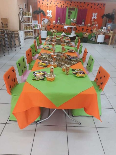 Flintstones birthday party | CatchMyParty.com Flintstone Party Decorations, Flintstones Birthday Party Decoration, Bambam Party Ideas 1st Birthdays, Flintstones 1st Birthday Party Ideas, Bedrock Birthday Party, Flintstones Party Favors, Pebbles Flintstone Party Decor, Flintstone Birthday Party Ideas, Flinstone Gender Reveal Ideas