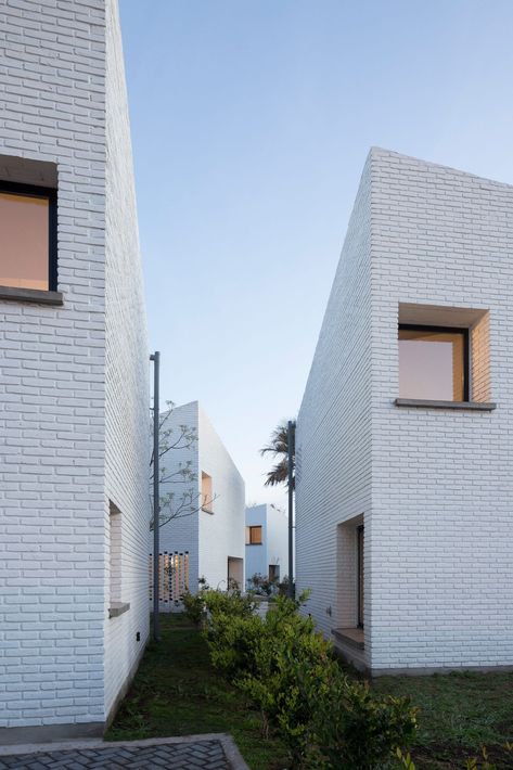 BBOA creates homes with slanted roofs for Morrison complex in Argentina Brick Projects, Angled Ceiling, Collective Housing, Architecture Program, English Architecture, Multifamily Housing, Angled Ceilings, Types Of Architecture, Brick Architecture