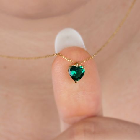 "Emerald is considered the stone of luck, of transcendental fidelity. It strengthens marriage and family ties and symbolizes rebirth. Make your loved one happy with our emerald heart necklace. Love is the shortest distance between two hearts. Let's meet this distance with our heart necklace. Emerald Heart Necklace, 14K Gold Heart Necklace, Valentine's Day Gift, Minimalist Necklace, Heart Jewelry, Love Heart Necklace, Anniversary Gift Emerald  is the birthstone for those born in May. F E A T U R E S * Made to Order. * Gold KT: 14K * Choice of Gold Color: Yellow Gold, Rose Gold, White Gold * Pendant Height: 9,14 mm / 0.36 inch * Pendant Width:  7,37 mm / 0.29 inch * Emerald Carat: 1.00ct * Length: 14\", 16\", 18\", 20\", 22\", 24\" * Setting Type: Bezel Setting * Ready to Ship in 1-3 Busines Emerald Heart Necklace, Emerald Jewelry Necklace, Body Jewelry Diy, Sapphire Jewelry Set, Necklace Emerald, Pretty Jewelry Necklaces, Minimalist Pendant, Accesories Jewelry, Family Ties