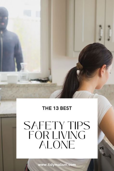 Young lady sitting at her countertop on her laptop. At the window beyond her left shoulder, we can see an intruder spying on her. He is wearing black and a black ski mask. Caption reads The 13 Best Safety Tips for Living Alone. House Safety Tips, Living Alone Safety Tips, Apartment Safety Hacks, Apartment Security Ideas, Apartment Safety Tips For Women, Tips For Living Alone, Safety Moment Ideas, Single Woman Home, Single Woman Apartment