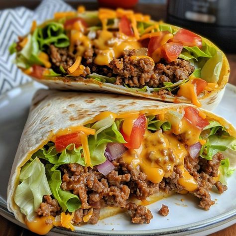 🌮🥩 Wrap up your cravings with this cheesy sensation! #NachoCheeseWrap #BeefyBites 🍽️ Nacho Cheese Beef Wrap 🛒 Ingredients: 1 lb ground beef 1 packet taco seasoning 1 cup nacho cheese sauce 1 cup shredded lettuce 1 cup diced tomatoes 1 cup shredded cheddar 4 large tortillas 👩‍🍳 Instructions: Cook Beef: In a skillet, cook ground beef with taco seasoning until browned. Assemble Wraps: Spread nacho cheese sauce on tortillas. Add beef, lettuce, tomatoes, and cheddar. Wrap & Serve: Fold tortill... Breakfast With Ground Beef, Nacho Cheese Beef Wrap, Folded Wraps, Food Cravings Healthy, Burritos Beef, Healthy Wrap, Cooking Soul Food, Beef Wraps, Nacho Cheese Sauce