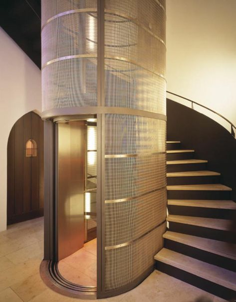 Stairs Around Elevator, Staircase Lift Design, Lift And Staircase Design, Cool Elevator Design, Glass Lift Design, Glass Elevator Design, Glass Elevator Design Interiors, Home Lift Design, Elevator In House