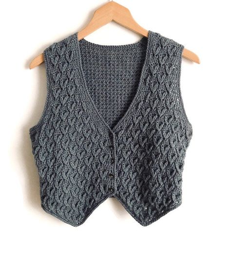 Crocheted waistcoat PDF pattern instant download, women's waistcoat  Two textured patterns have been used to make this waistcoat with deep V-neck and adjustable half belt at the back In addition to this digital file you will need: approx 200(200:225)g of a 4 ply yarn 🧶  3.00mm crochet hook  5 small buttons small buckle to fit a completed strap The instructions are for three different sizes: Bust: 86:91:96 cm  Length: 43:46:48 cm Level: Intermediate to advanced  Instructions in English language Mens Vest Pattern, Crochet Vest Pattern Free, Crocheted Vest, Waistcoat Pattern, Crochet Waistcoat, Crochet Sweater Vest, Vest Pattern Free, Womens Waistcoat, Gilet Crochet