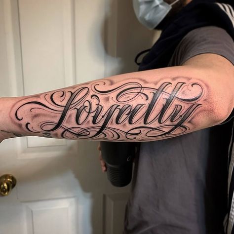 Loyalty Tattoo Shading Around Letters Tattoo, Loyalty Script Tattoo, Old English Forearm Tattoo, Loyalty Arm Tattoo, Chest Number Tattoo, Loyalty Hand Tattoo, Loyalty Tattoo Stencil, Arm Lettering Tattoo, Loyalty Out Values Everything Tattoo