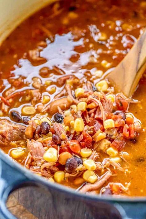 Pulled Pork Taco Soup - the BEST taco soup EVER!!! Pulled pork, pinto beans, black beans, diced tomatoes and green chiles, corn, taco seasoning, ranch seasoning, chicken broth. SO easy to make. Just dump everything in the pot, bring to a boil and simmer. Can also make in the #slowcooker. Great for tailgating and potlucks. Can freeze leftovers for a quick meal later. Our favorite taco soup recipe! #soup #taco #pulledpork Pork Roast Soup Leftover, Pulled Chicken Soup, Soup With Pork Tenderloin, Pork Loin Soup Recipes, Pork Taco Soup, Canned Pork Recipes, Ranch Seasoning Chicken, Pulled Pork Soup, Best Taco Soup