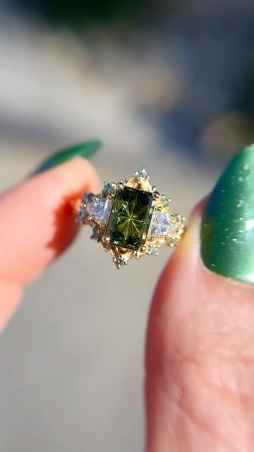 Uma | Engagement Rings on Instagram: "I realize I never share my larger briar setting, but this is a beautiful green Starbrite sapphire with lab diamond sides and mint diamond accents. The larger briar has an overall bigger appearance with larger sides/accents and slightly bigger 🍃 to even out the ratio of the larger stones.🖤" Mint Sapphire Ring, Engagement Rings Green Stone, Green Diamond Ring, Green Engagement Rings, Paper Rings, Future Engagement Rings, Paper Ring, Vogue Dress, Green Rings