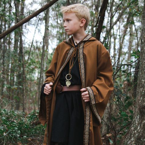 This Celtic Robe is a great costume accessory for anyone filling out a Wizard, Warlock, Medieval, Fantasy, or Renaissance costume.  Great for cosplay or LARP event.  Each robe is made from 100% polyester knit fabric with jacquard trim.  Robes are designed with large hoods and sleeves for dramatic affect. COLOR OPTIONS: Black Robe with Tan/Black Trim Brown Robe with Black/Tan Trim Tan Robe with Beige/Tan Trim Gray Robe with White/Gray Trim White Robe with Beige/Tan Trim Navy Blue with White/Grey Wizard With Staff, Sorcerer Costume, Viking Cape, Wizard Cape, Wizard Outfit, Mage Robes, Wizard Robe, Wizard Cosplay, Medieval Men