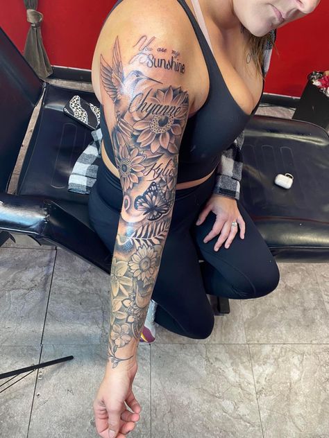 Sleeve With Names Tattoo, Finishing Sleeve Tattoo Ideas, Family Tattoo Sleeve For Women, Birth Flower Tattoos Arm Sleeve, Butterfly Full Sleeve Tattoo, Women Tattoo Sleeve Ideas Classy, Top Arm Sleeve Tattoo Women, Portrait Sleeve Tattoo For Women, Name Sleeve Tattoo For Women