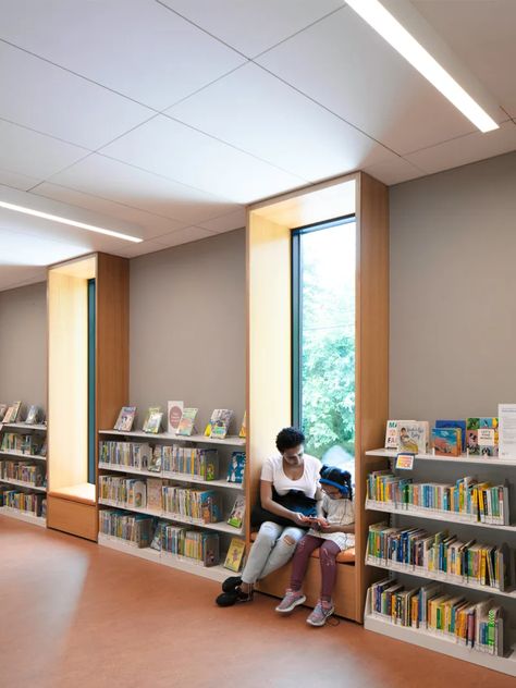 Andrew Berman Architect, Michael Moran · Van Cortlandt Branch Library · Divisare Arch Library, Cave Library, Boston Library, Architecture Names, Kindergarten Architecture, Architect Project, Library Seating, Sunrise Home, Steel Architecture