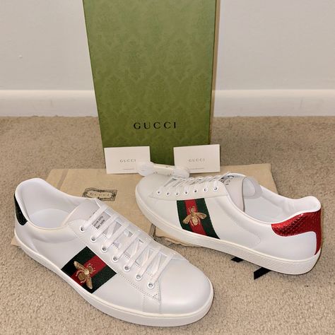 Men’s Gucci Ace White Leather Sneakers With Embroidered Bee -Msrp $890 + Tax! -Size Gucci 11 (Uk 11 / Us 11.5 / It 45) -Brand New With Box -Comes With Gucci Cards, Dust Bags, Extra Set Of Laces The Gucci Ace Low-Top Sneaker In Leather Is Embellished With The Gold Embroidered Bee Against The Web Stripe. The Bee Is An Archival Code First Introduced In Gucci Ready-To-Wear In The 1970s. -White Leather With Red Leather Detail On The Heel Of One Shoe And Green On The Other -Green And Red Web -Gold Thr Designer Leather Custom Sneakers With Embroidered Logo, Luxury Custom Sneakers With Embroidered Logo And Round Toe, Embroidered Bee, Gucci Men Shoes, Red Web, Gucci Sneakers, White Leather Sneakers, Leather Detail, The Bee