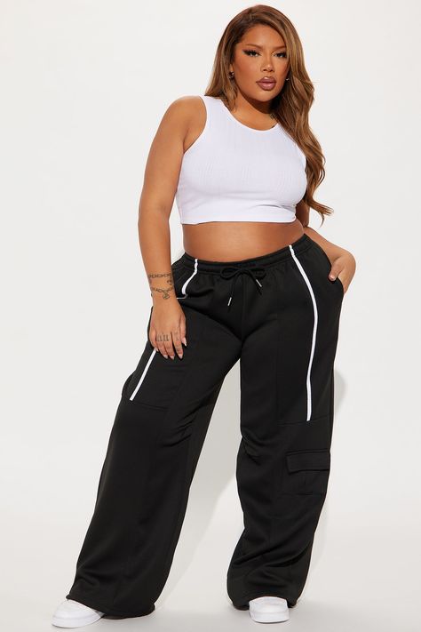 Available In Black/White And Cream/combo. Jogger Pant Elastic Waistband High Rise Drawstring Hand Pockets Cargo Pocket Stripe Stretch Wide Leg Adjustable Toggler Hem 30" Inseam Main Fabric: 100% Polyester Imported | Street Vibe Wide Leg Jogger Pant in Black/White size 1X by Fashion Nova Wide Leg Joggers Outfit, Black Jogger Pants, Joggers Outfit, Women Street, Black Joggers, Cargo Pocket, Jogger Pants, Fashion Nova, Wide Leg