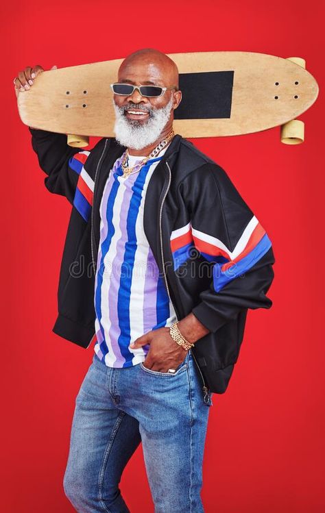 Skating is my new hobby. a mature man holding a skateboard against a red background. royalty free stock images Holding Skateboard Pose, Holding A Skateboard, Holding Skateboard, Fashion Male, New Hobbies, Red Background, Character Design Inspiration, Skating, Stock Images Free