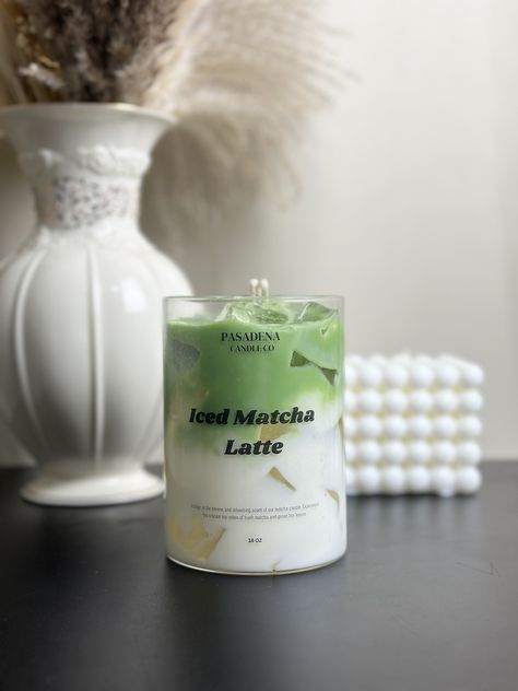 Introducing the Pasadena Candle Co. Iced Matcha Latte Candle, now available for pre-order! This exquisite candle captures the refreshing and invigorating aroma of a perfectly brewed iced matcha latte. Scent Notes: - Top: Fresh Matcha, Green Tea Leaves - Middle: Creamy Milk, Vanilla Bean - Base: Light Honey, Sweet Sugar Immerse your space in the calming and uplifting scent of matcha, creating an atmosphere of tranquility and rejuvenation. Perfect for any occasion, this candle is a must-have for matcha lovers and those who appreciate unique, realistic scents. It also makes the perfect gift for friends, family, or any candle enthusiast. Secure your Iced Matcha Latte Candle today and be the first to enjoy this delightful fragrance! Pasadena Candle Co is a perfect gift store when you think abou Matcha Candle, Milk Candle, Realistic Candles, Drink Candles, Green Candles, Green Tea Leaves, Iced Matcha Latte, Gel Candles, Hand Painted Candles