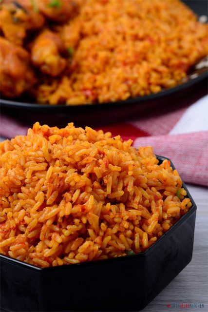 Nigerian Jollof Rice or Jellof rice is a rich and incredibly tasty west African one-pot Meal. It is a very versatile dish, and it is usually made from scratch using Rice, Tomatoes, Pimento peppers, Tomato paste, Scotch bonnet, Onions, Salt, and other spices. Nigerian Jollof Rice, Nigeria Food, African Recipes Nigerian Food, West African Food, Nigerian Recipes, African Cooking, Jollof Rice, African Recipes, Nigerian Food